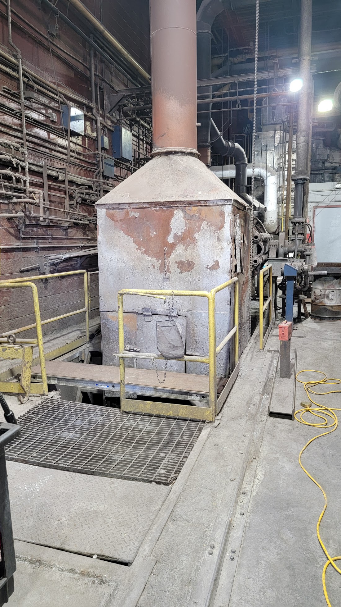 Before - deteriorated silver pour shroud